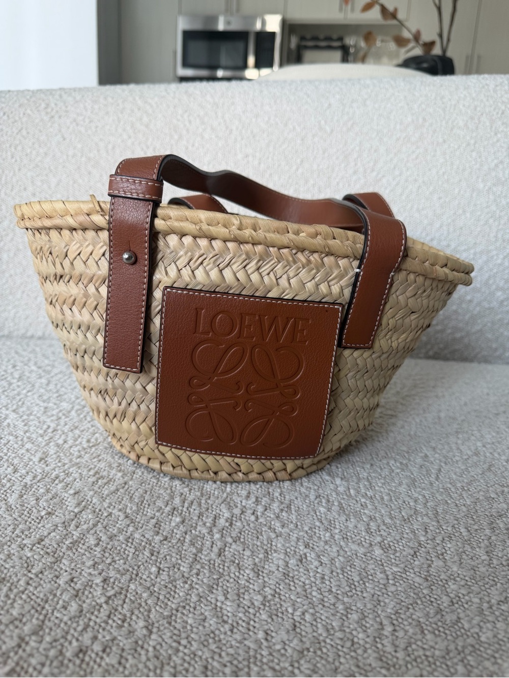 Loewe small basket bag in palm leaf and calfskin.